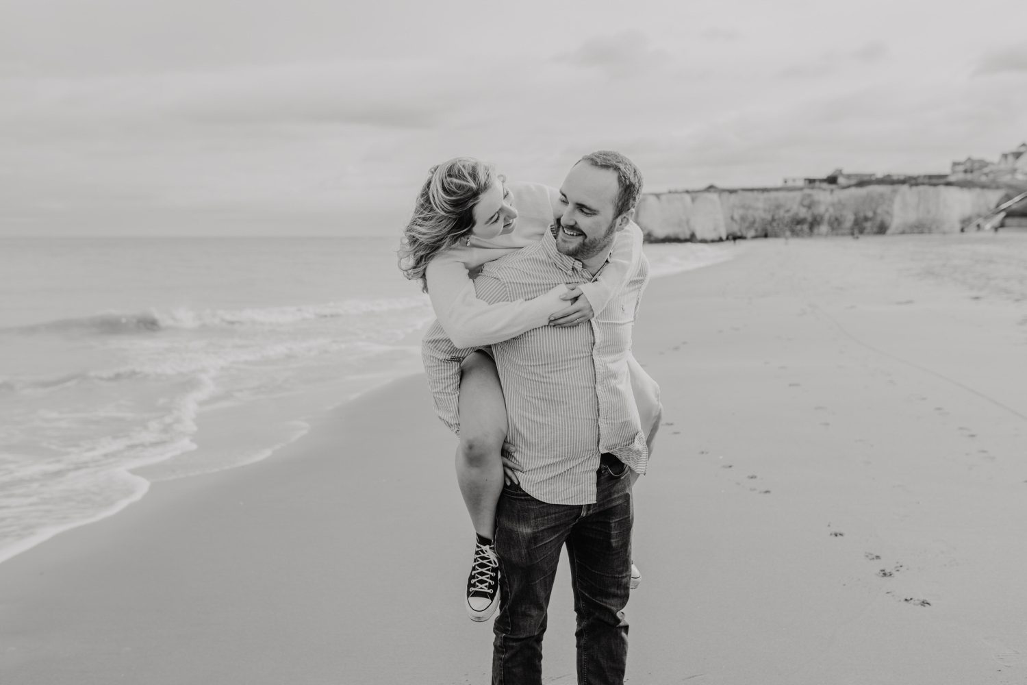 black and white photo of couple posing together for their kent couple shoot