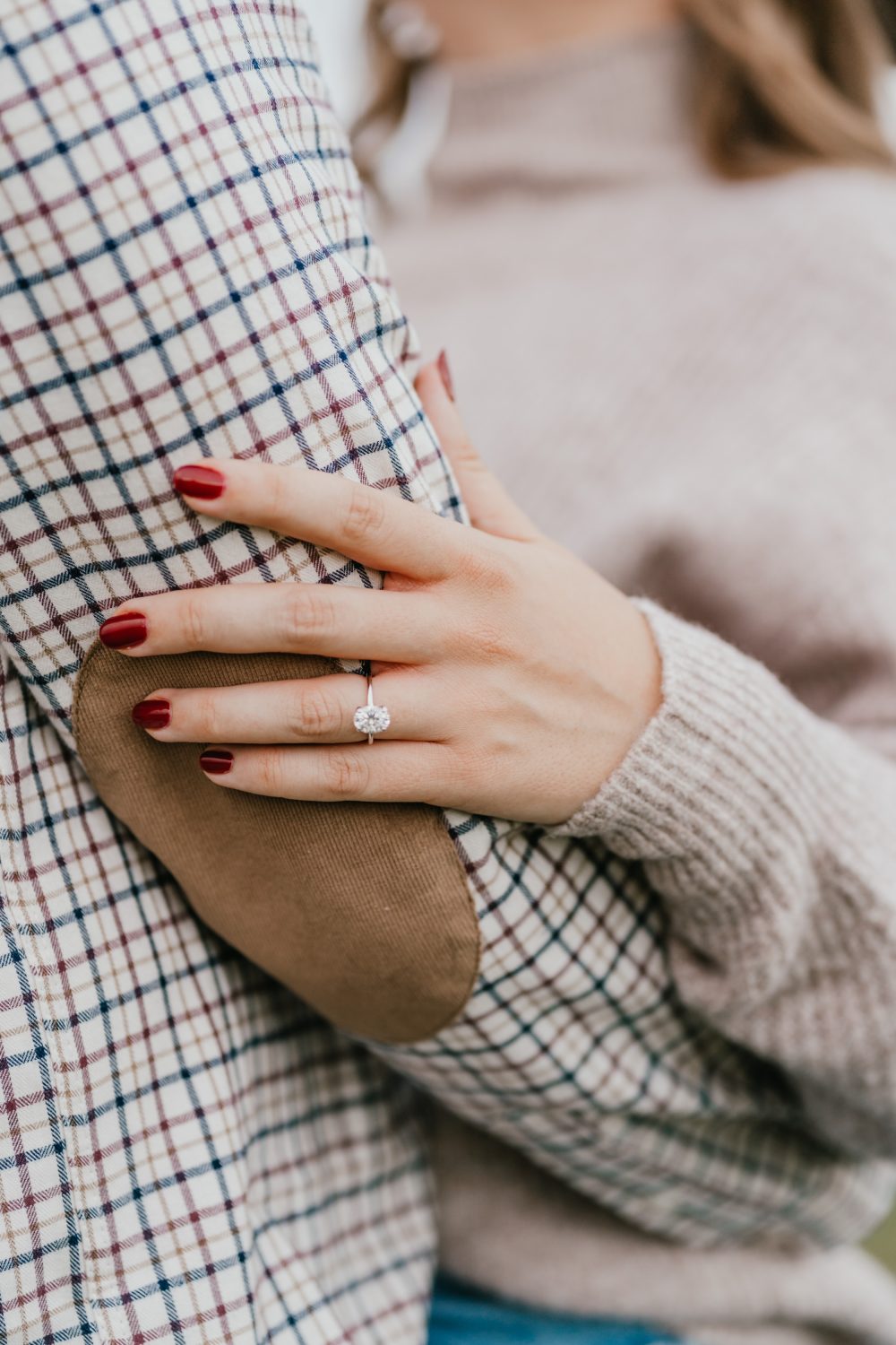 close up of a bride-to-be's engagement ring