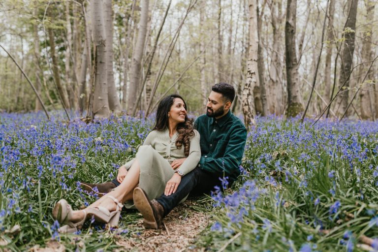 couple embracing in bluebell woods in Kent