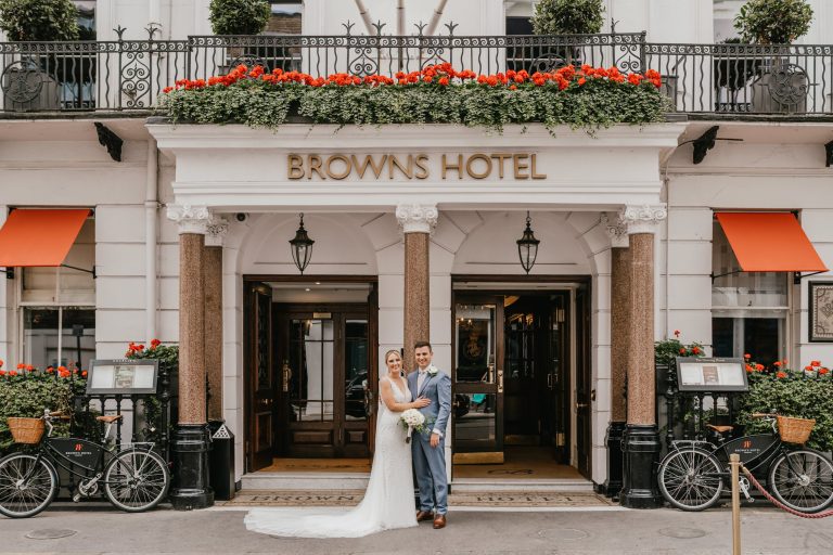 bride and groom outside browns hotel in london