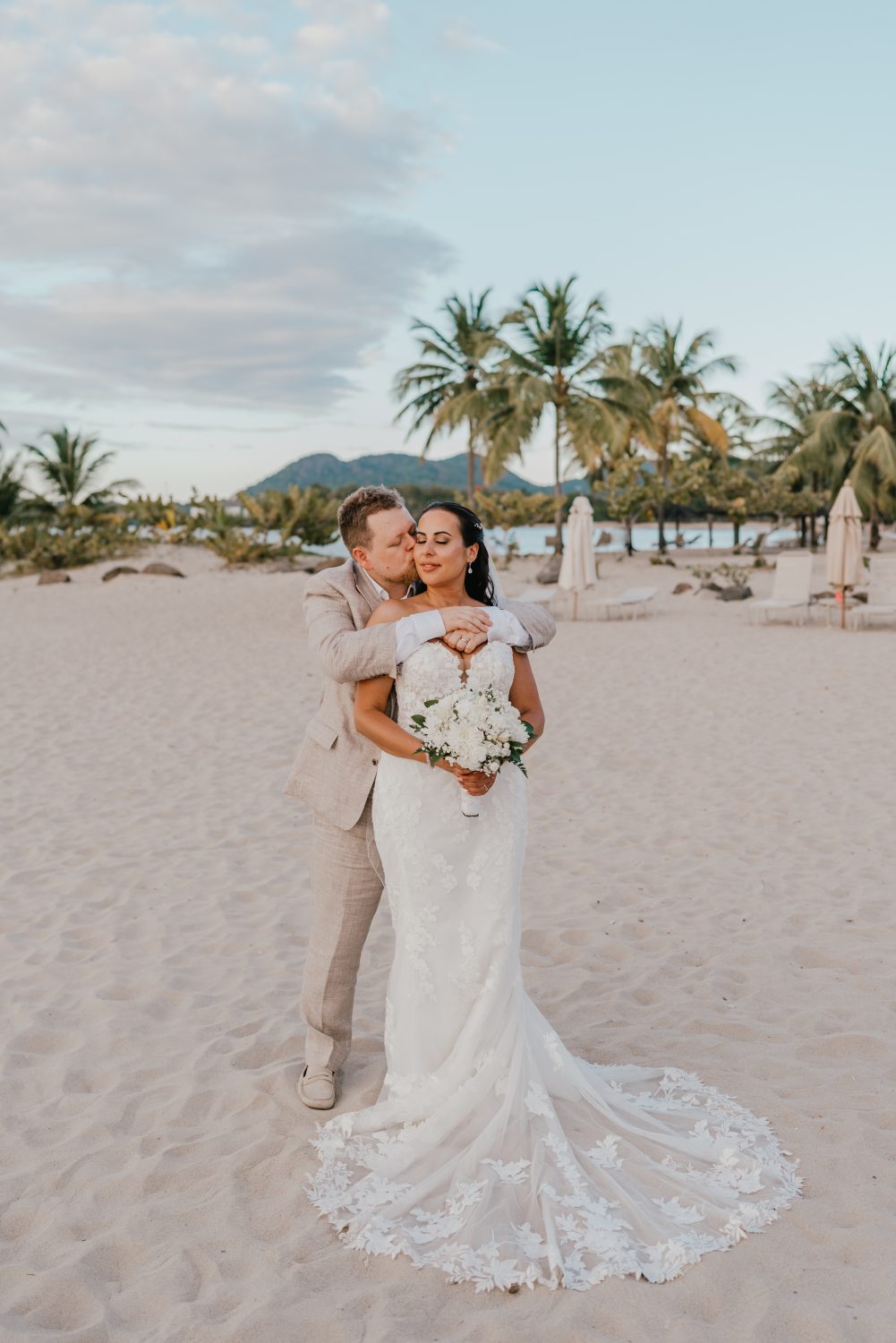 bride and groom on the beach in saint lucia at stolentime by rendezvous wedding venue