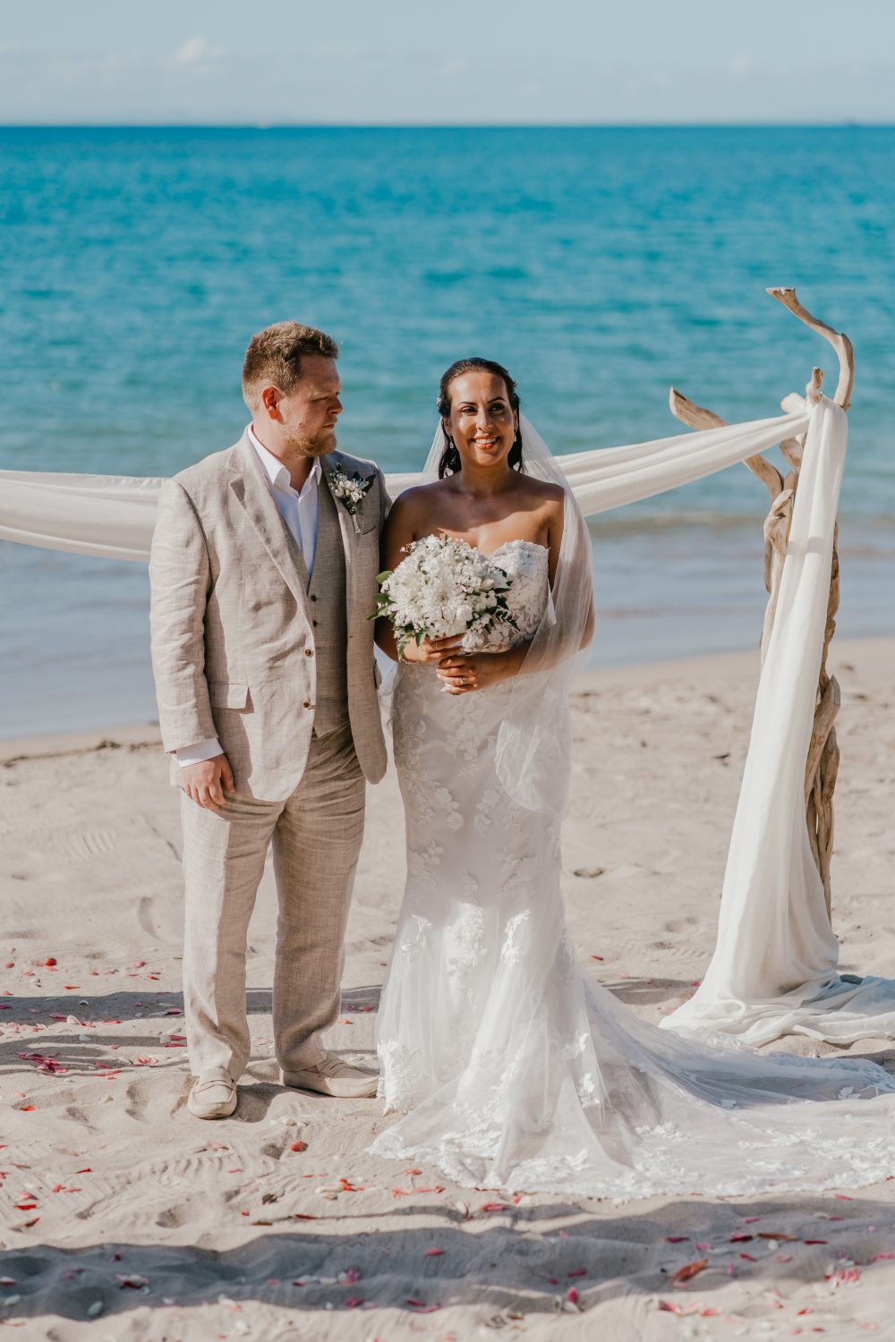 bride and groom marry on the beach in saint lucia at stolentime by rendezvous wedding venue