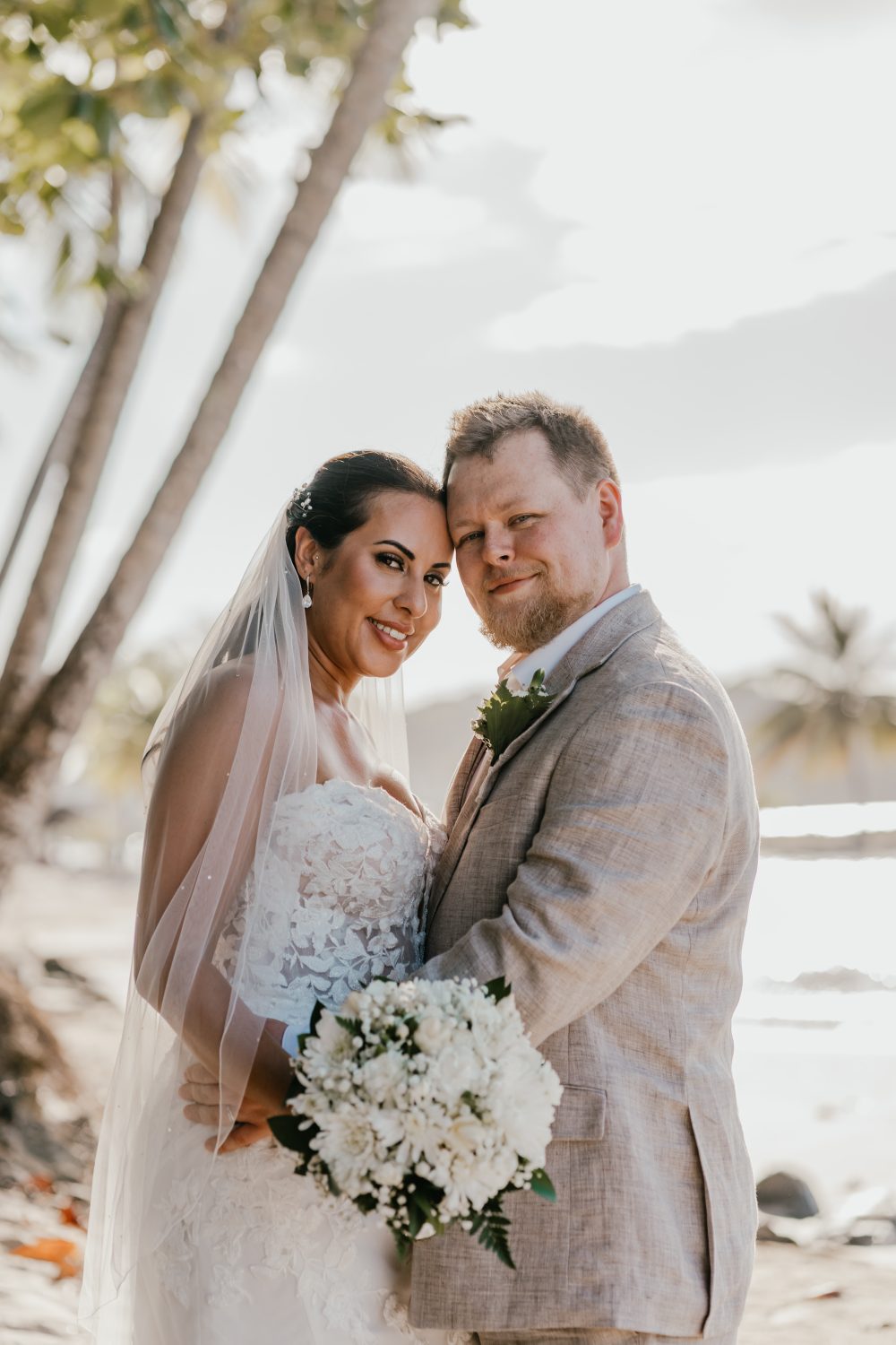 bride and groom on the beach in saint lucia at stolentime by rendezvous wedding venue