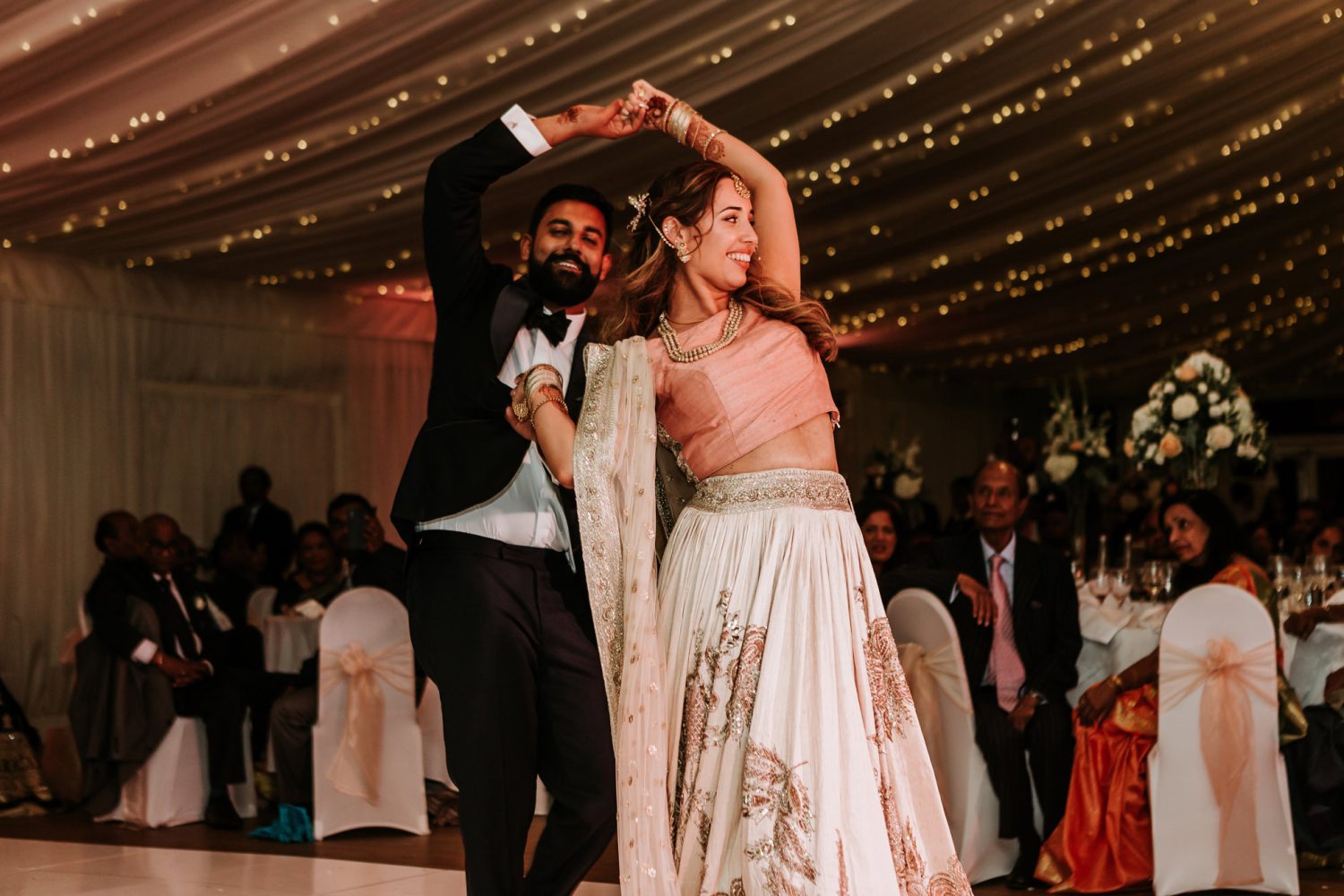 bride and groom first dance at indian wedding at quendon hall in essex