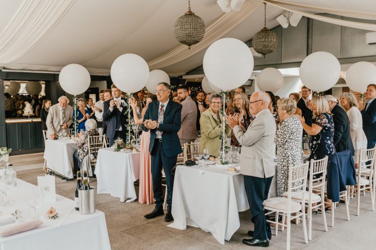wedding guest applause for speeches in the orangery at baddow park house wedding venue in essex