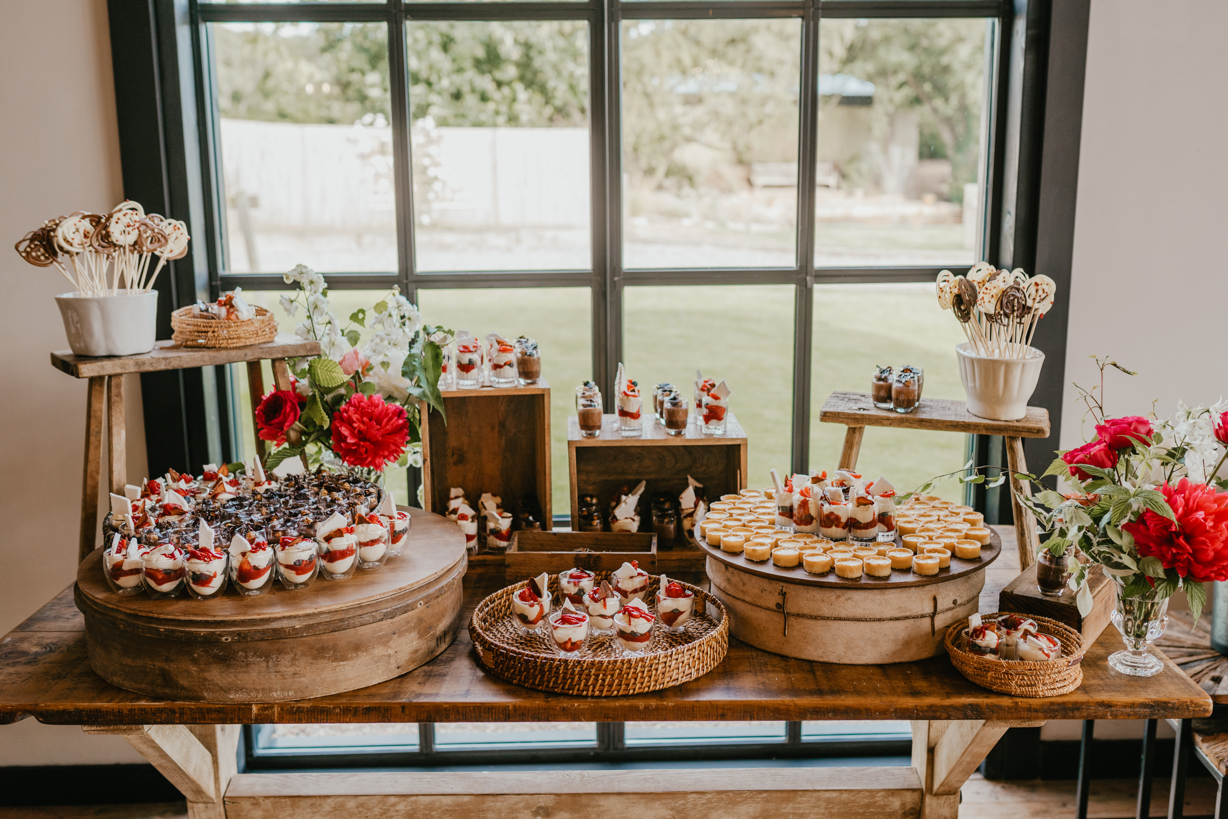 dessert table in the baby barn at botley hill barn wedding venue in surrey