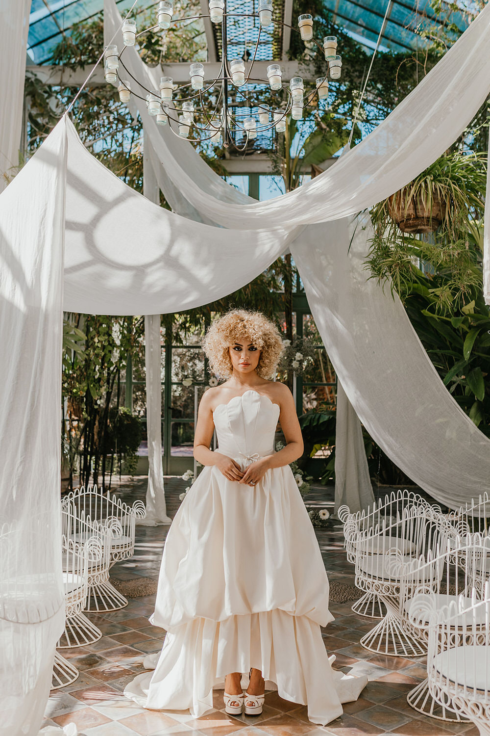 bridal model stands in middle of the aisle in wedding ceremony setup at beldi country club in morocco