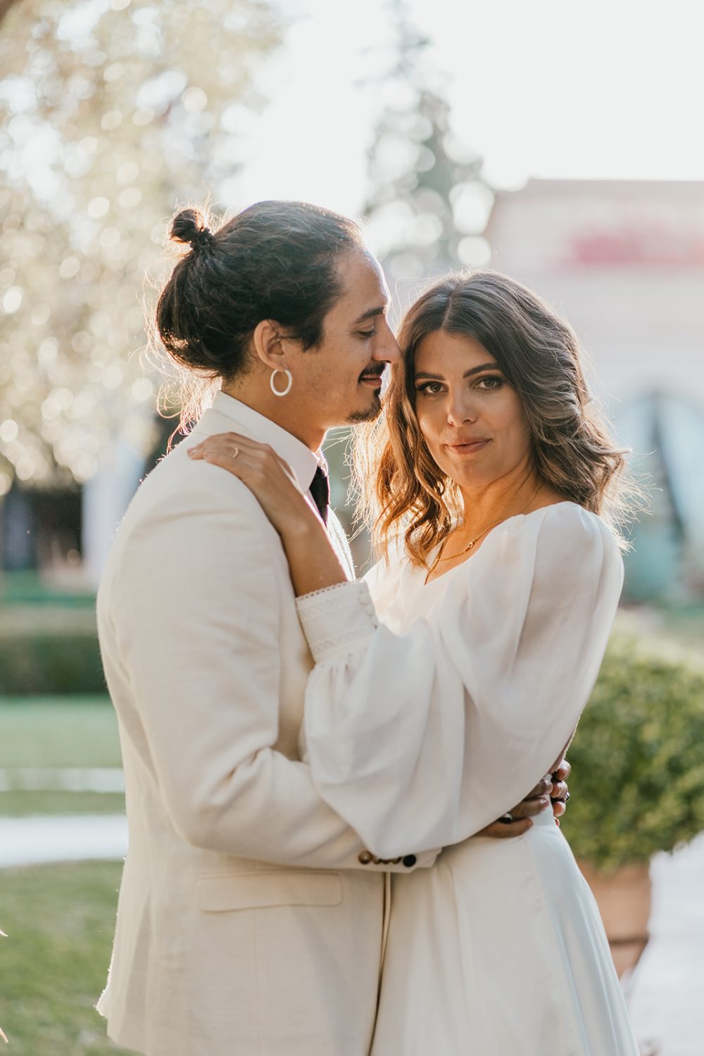 bride and groom pose in golden hour light at beldi club marrakech