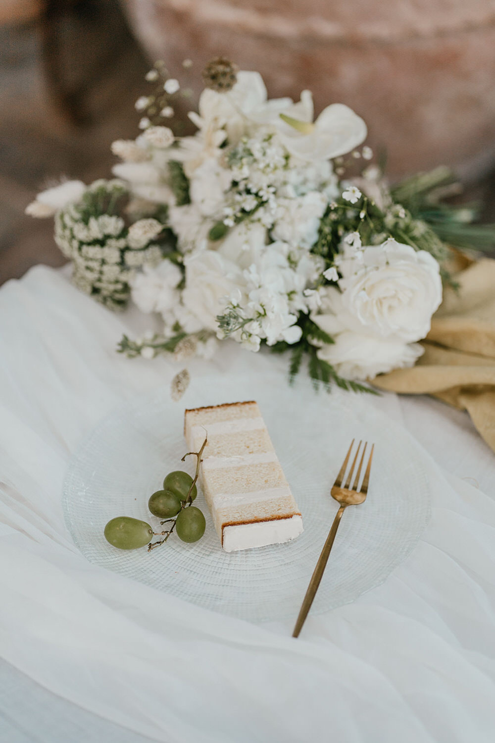 slice of wedding cake on glass plate