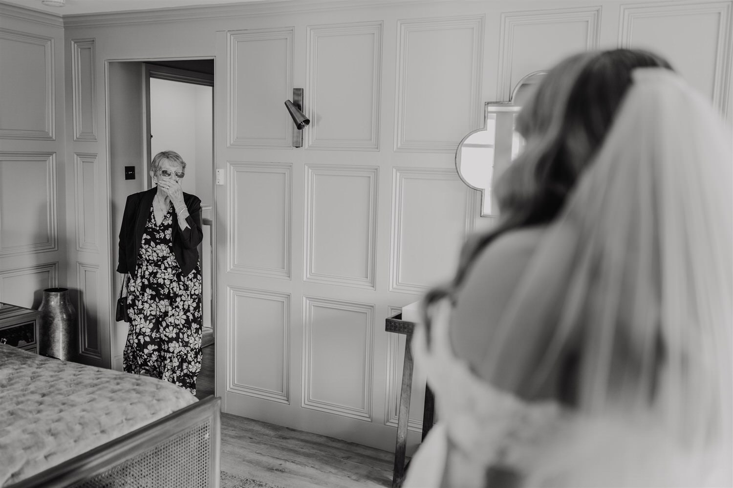 black and white photo of bride reveal to grandma at chapel house estate wedding