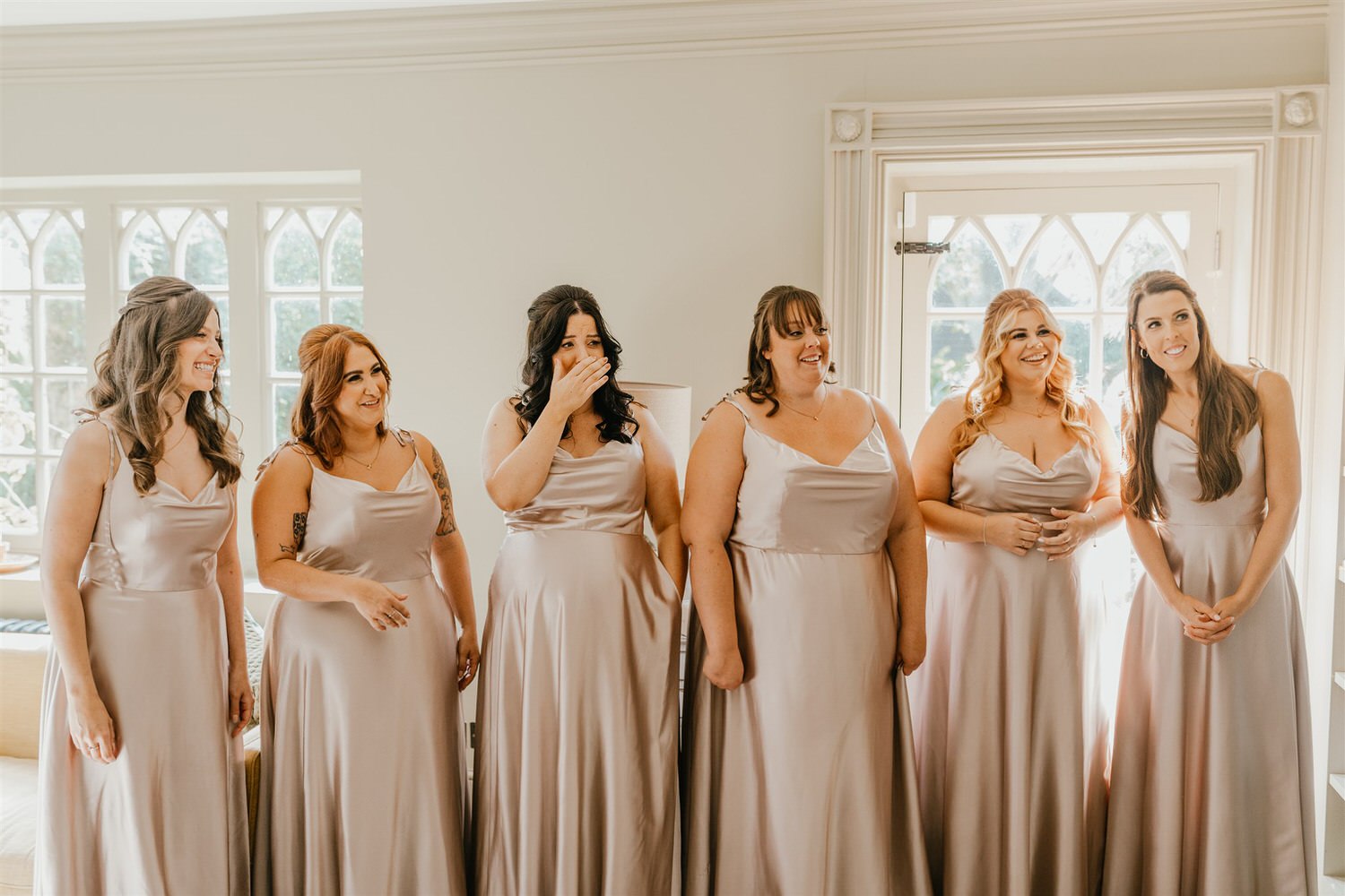 bride reveal to bridesmaids at chapel house estate wedding