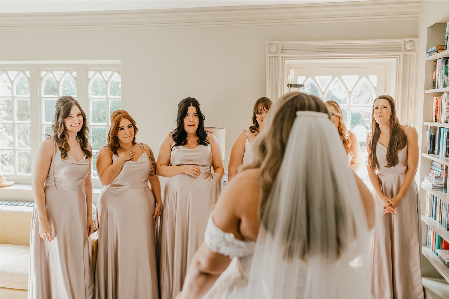 bride reveal to bridesmaids at chapel house estate wedding