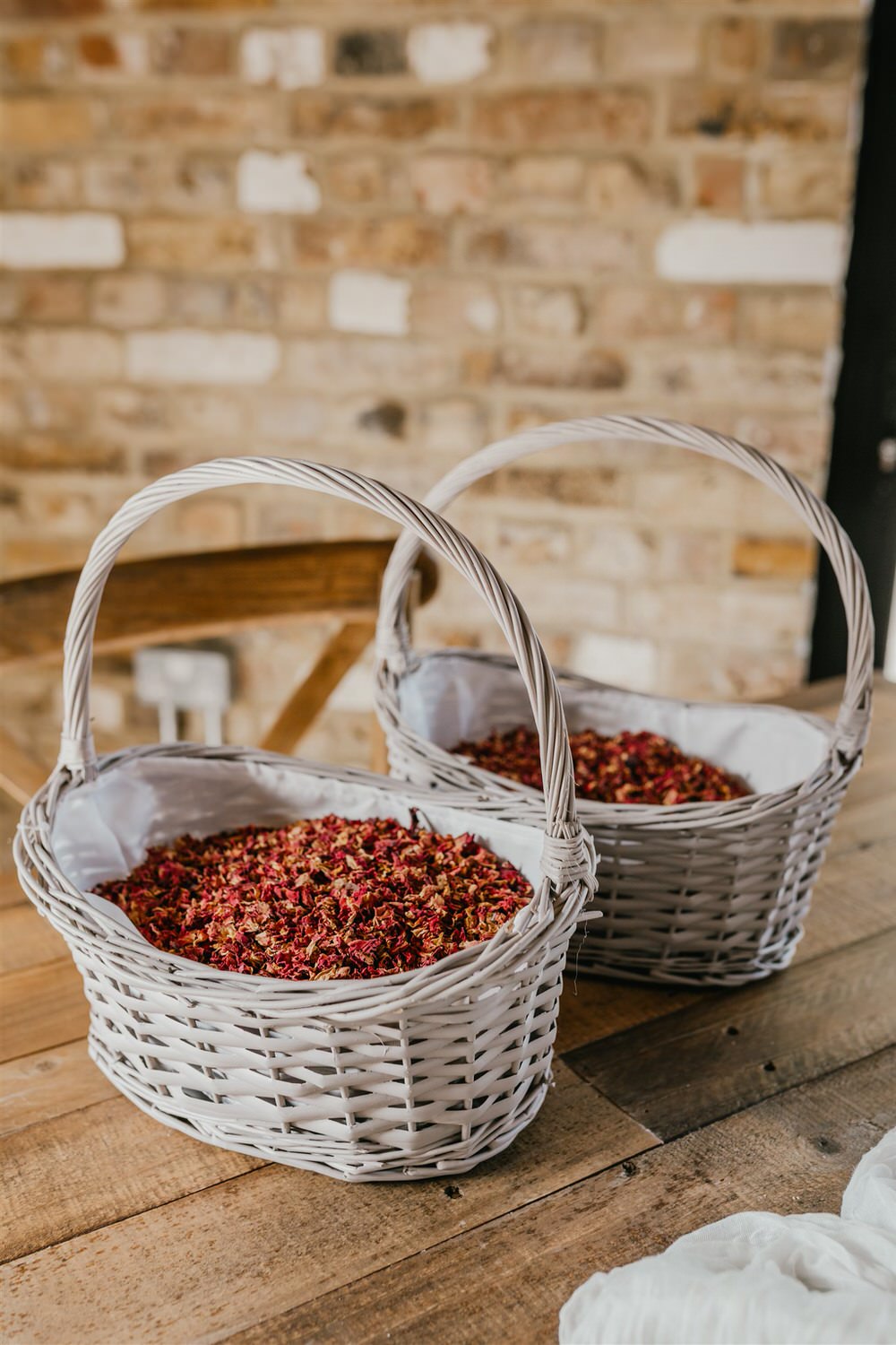 rustic baskets filled with dried flower petal confetti