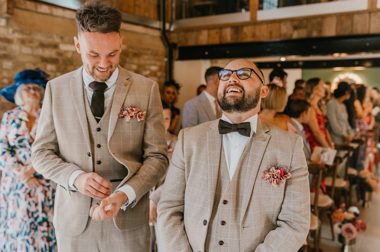groom and best man laugh at dog walking down the aisle at chapel house estate wedding