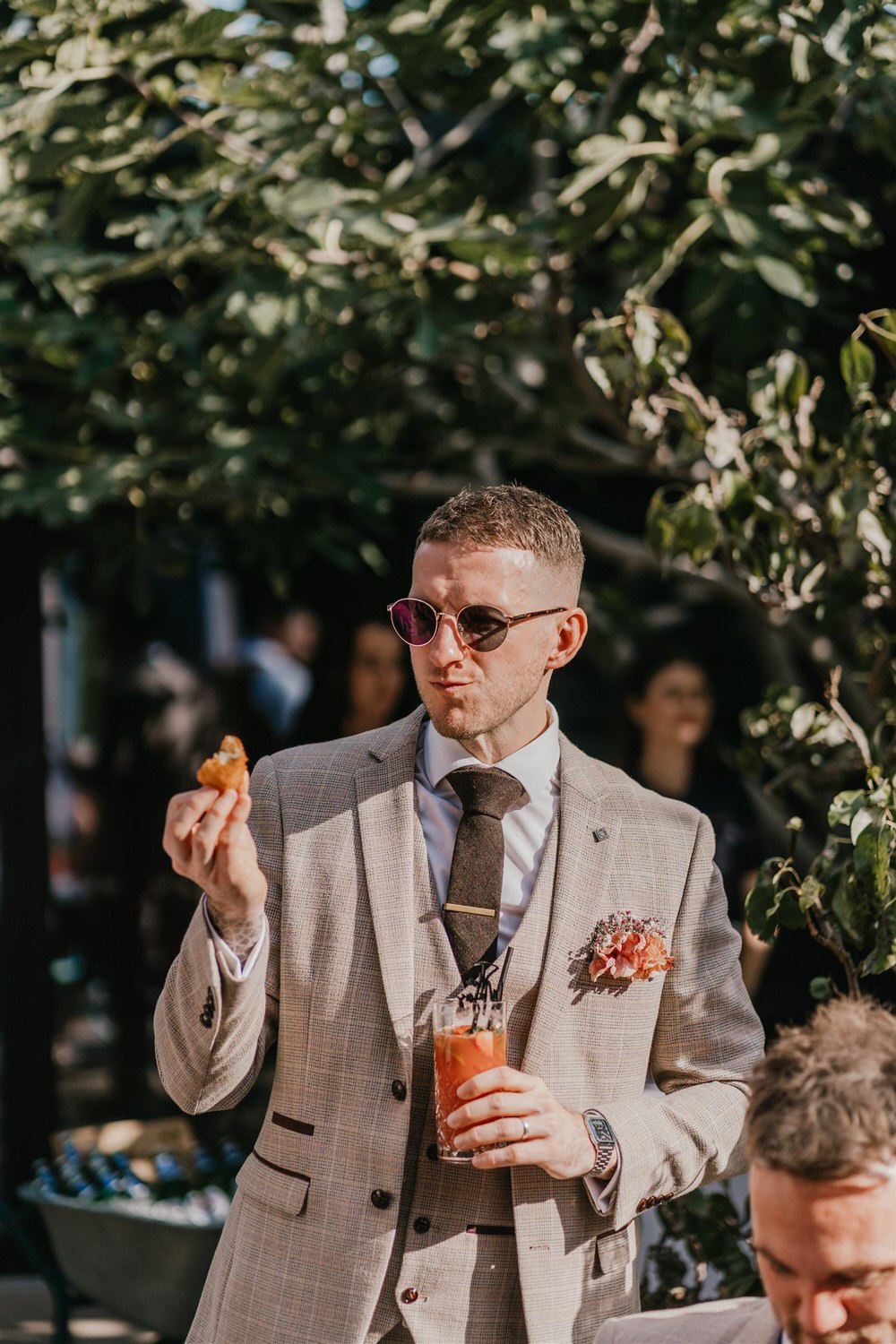 drinks reception in the courtyard at chapel house estate wedding venue in kent