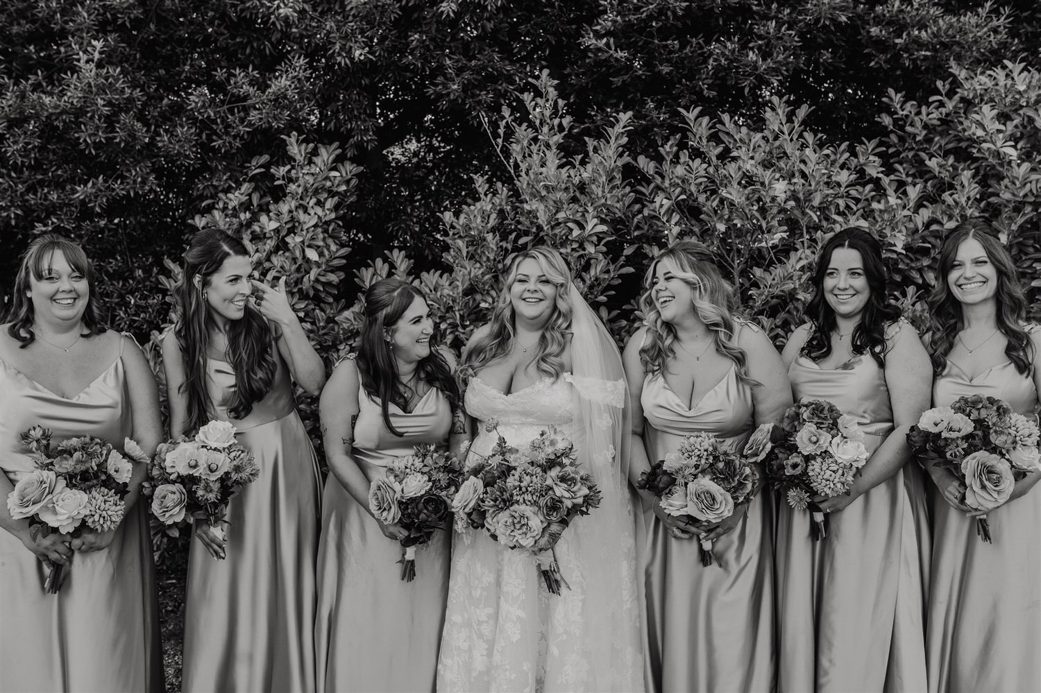black and white group photo of bridesmaids at chapel house estate wedding