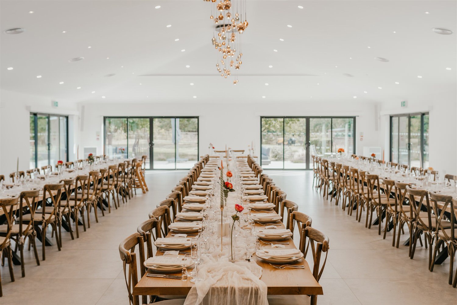 wedding breakfast setup with long tables at chapel house estate wedding