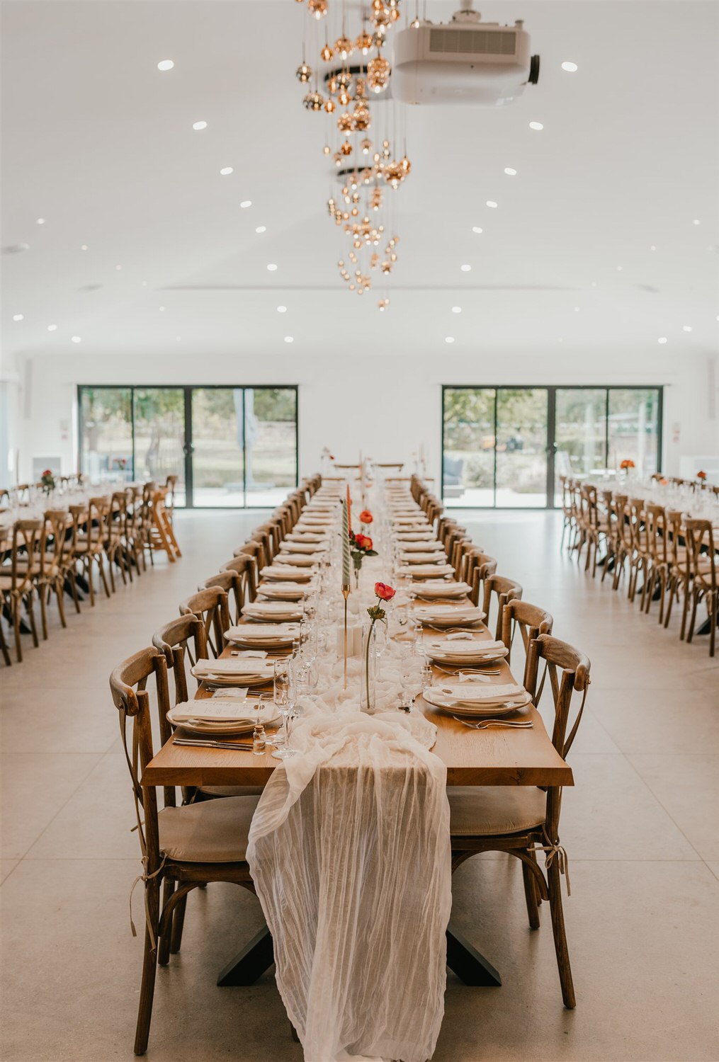wedding breakfast setup with long tables at chapel house estate wedding