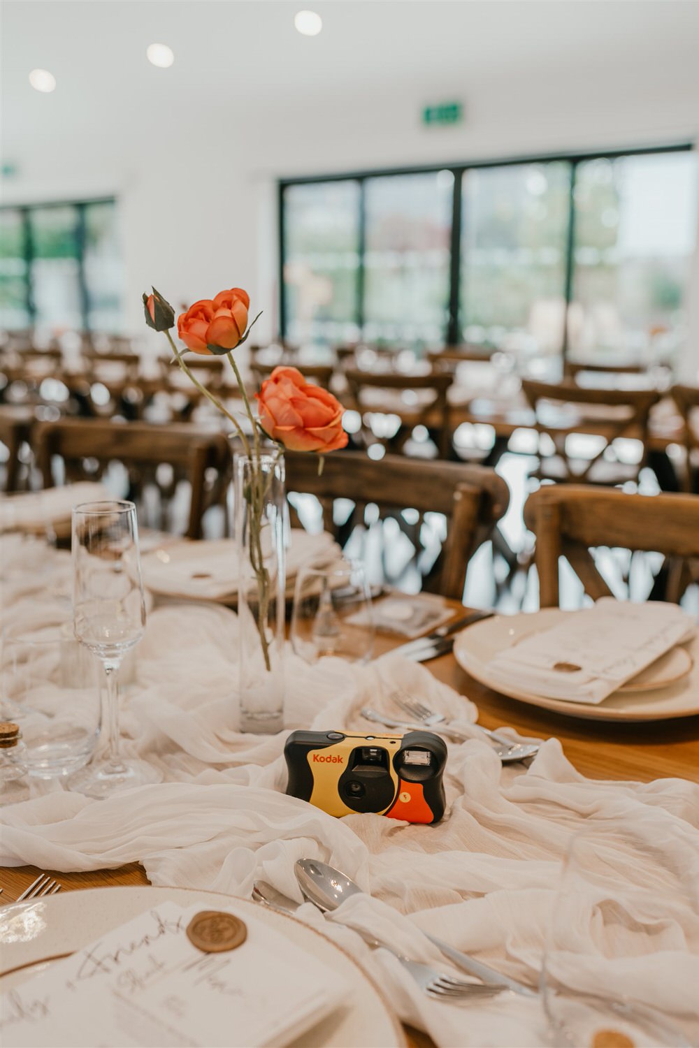 wedding breakfast setup with disposable cameras at chapel house estate wedding