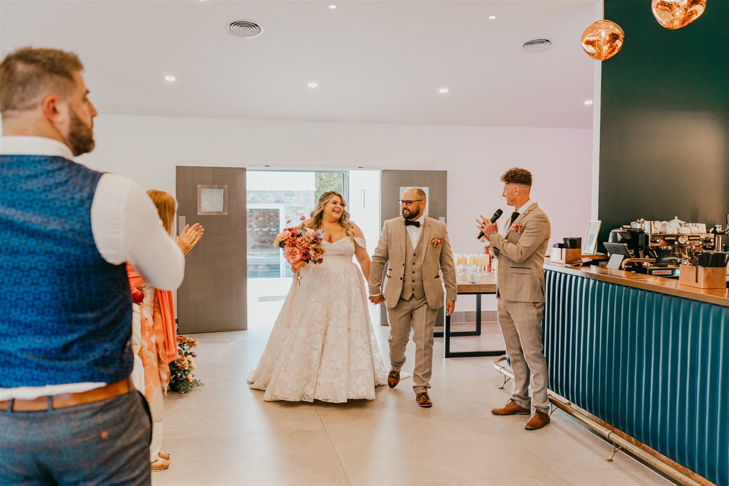 bride and groom entrance into wedding breakfast at chapel house estate