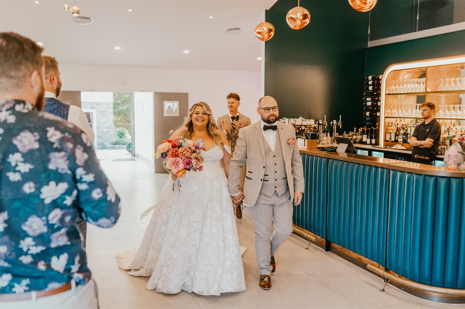 bride and groom entrance into wedding breakfast at chapel house estate