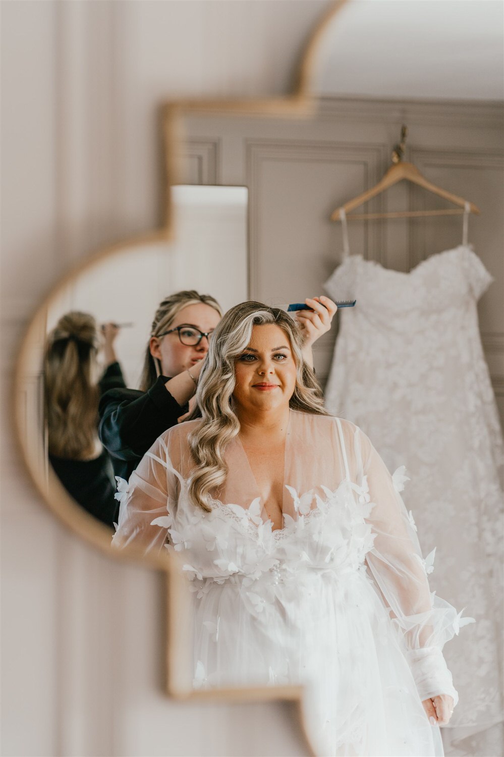 bride having final touch ups during bridal prep at chapel house estate wedding