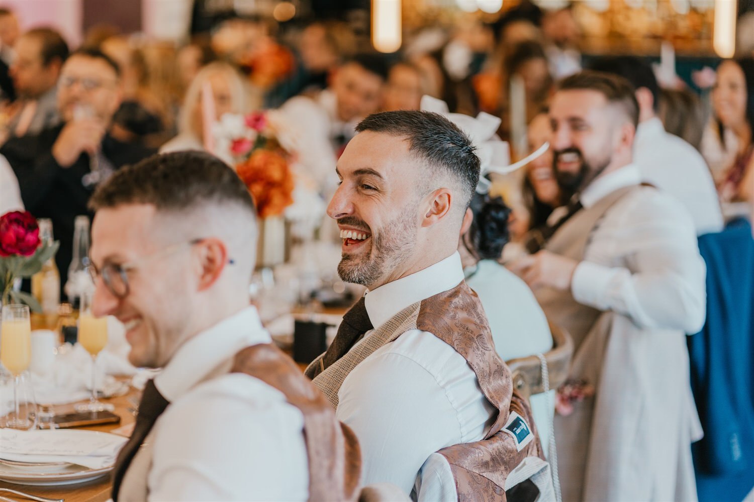 guest laughing during wedding speeches at chapel house estate wedding