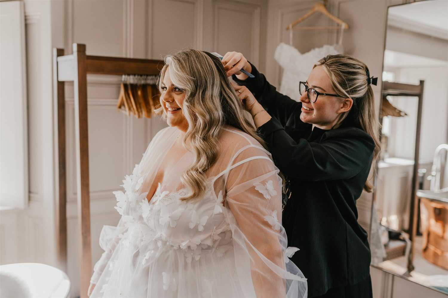 bride having final touch ups during bridal prep at chapel house estate wedding