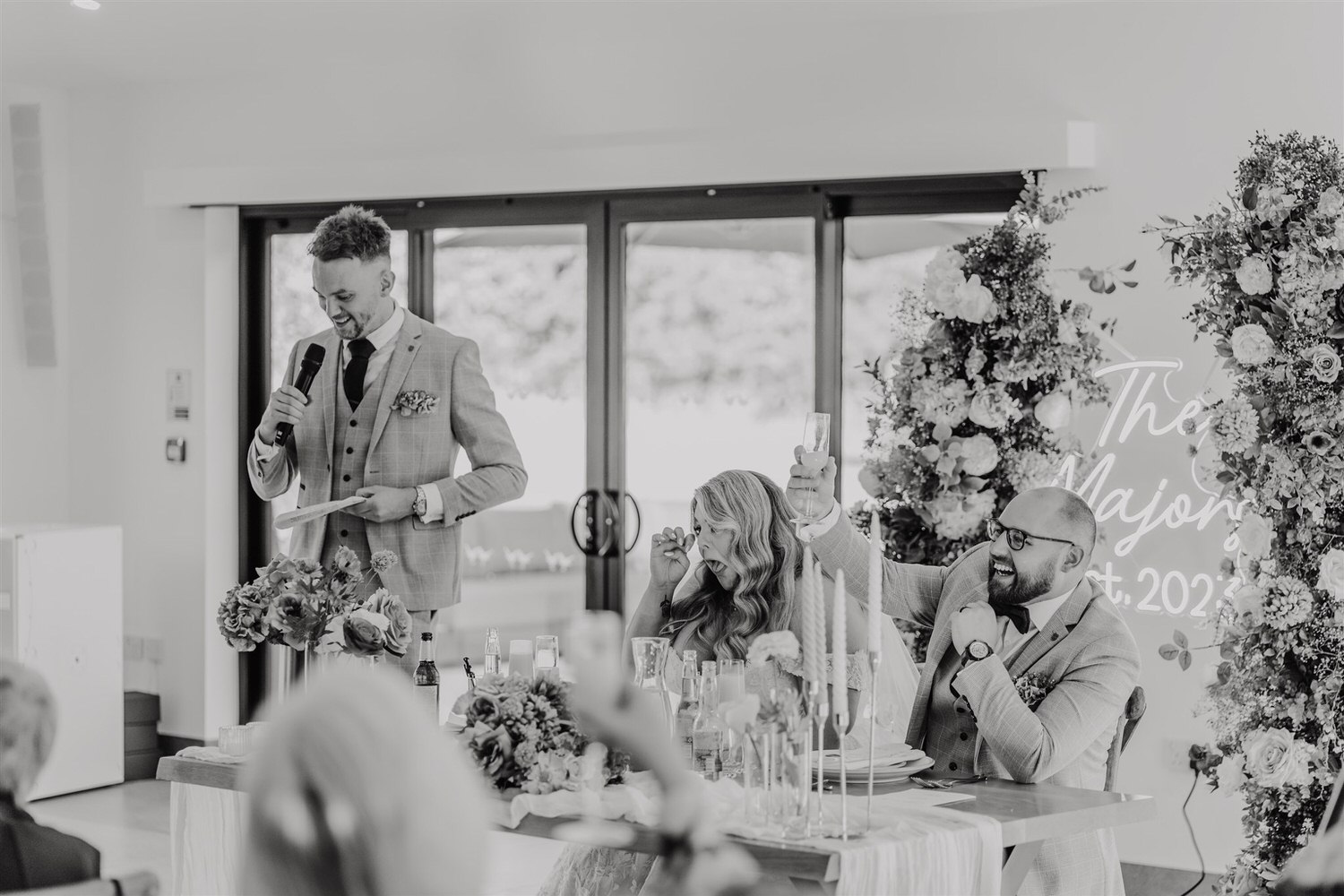 black and white photo of wedding speeches at chapel house estate wedding