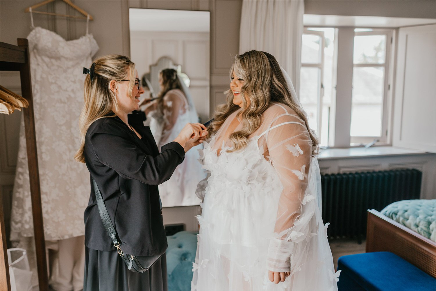 bride having final touch ups during bridal prep at chapel house estate wedding