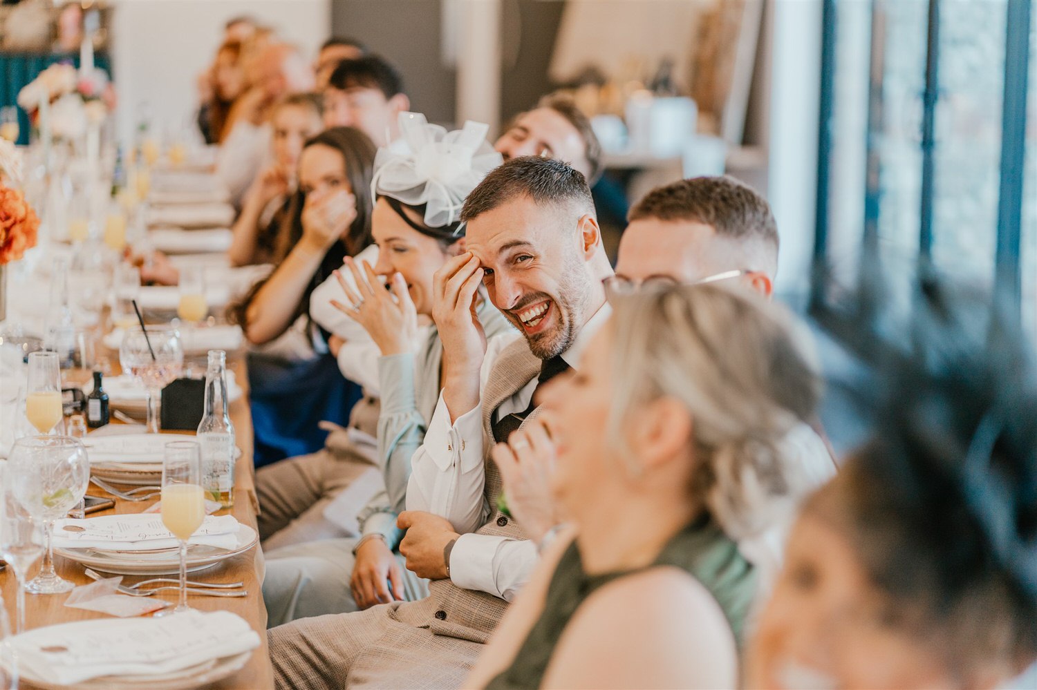 guest laughing during wedding speeches at chapel house estate wedding