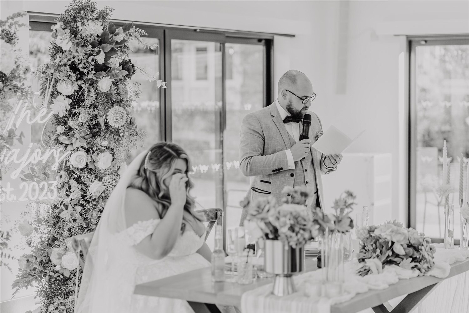 black and white photo of wedding speeches at chapel house estate wedding