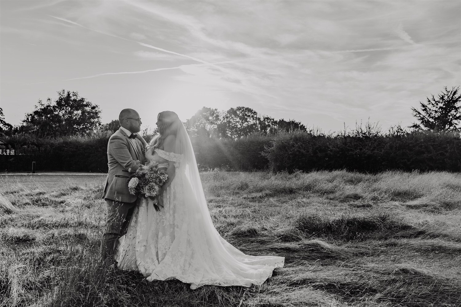 black and white photo of bride and groom sunset couple portraits at chapel house estate in kent