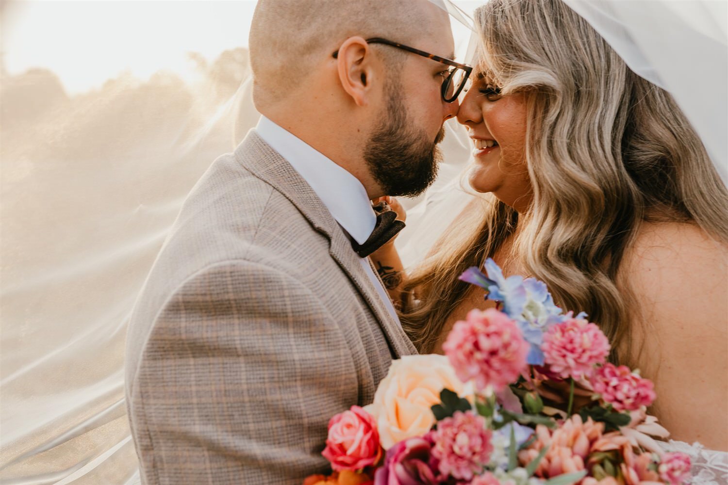 bride and groom sunset couple portraits with veil at chapel house estate in kent