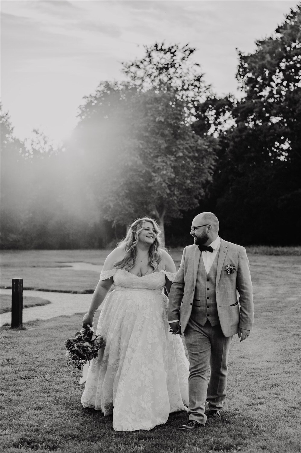 black and white photo of bride and groom sunset couple portraits at chapel house estate in kent