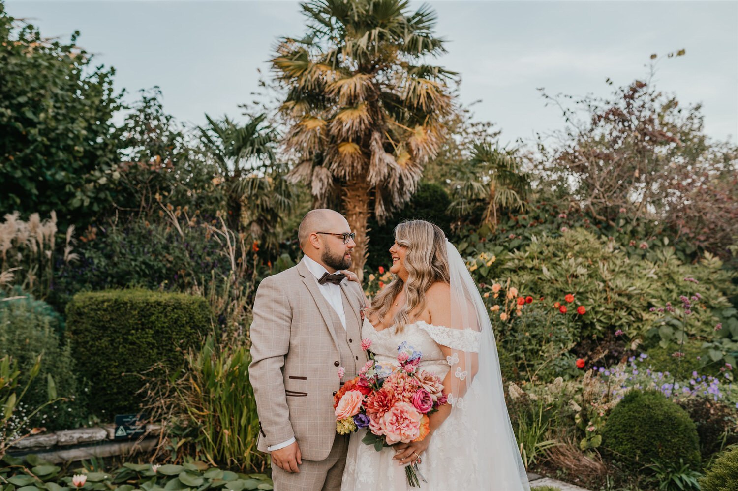 bride and groom couple portraits in the gardens at chapel house estate