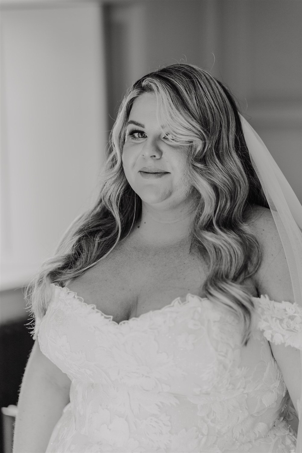 black and white photo of bride during bridal prep at chapel house estate wedding