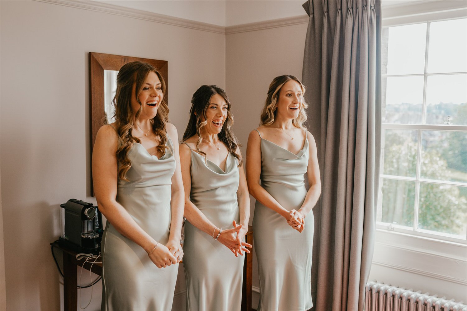 bridesmaids reaction to seeing bride in her wedding dress in hotel du vin