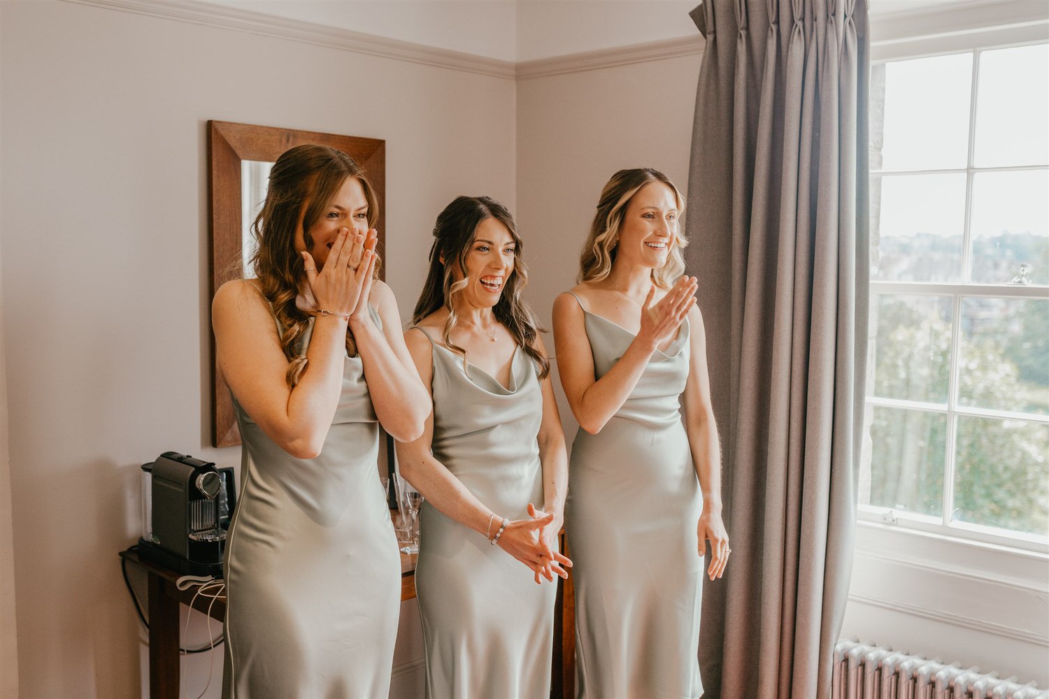 bridesmaids reaction to seeing bride in her wedding dress in hotel du vin