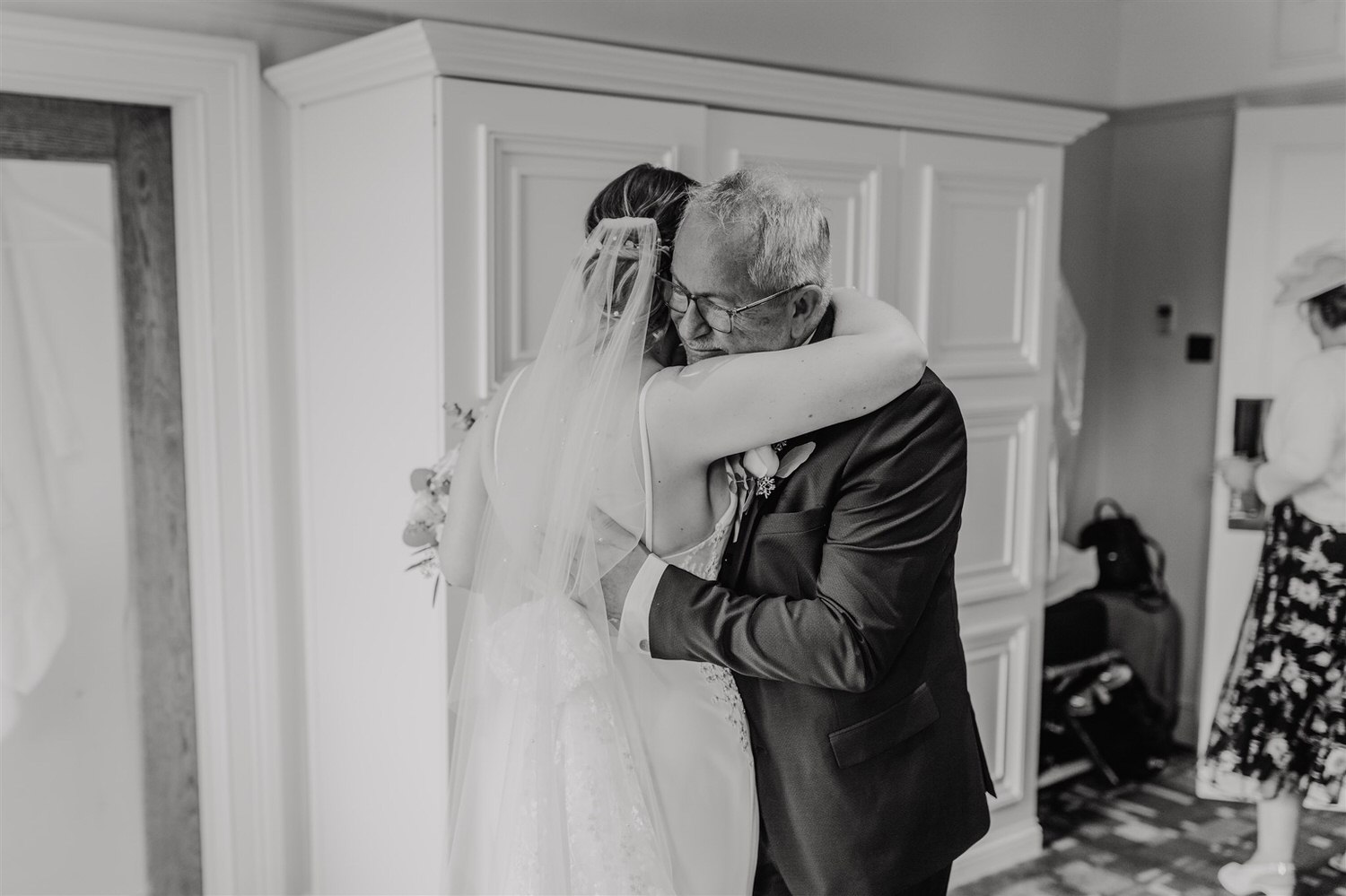 black and white photo of father of the bride reaction to seeing bride in her wedding dress