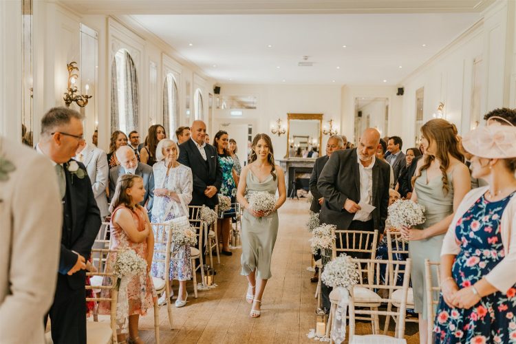 bridesmaids walking down the aisle at hotel du vin tunbridge wells wedding ceremony