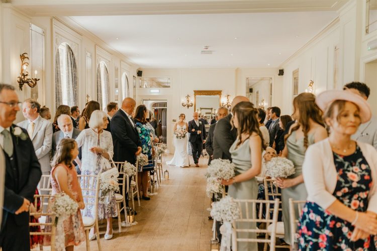 bride walking down the aisle with her father at hotel du vin wedding ceremony