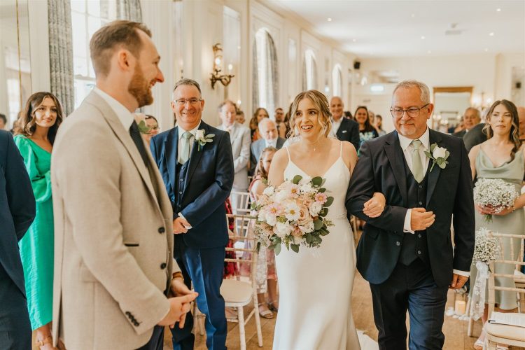 bride walking down the aisle with her father at hotel du vin wedding ceremony