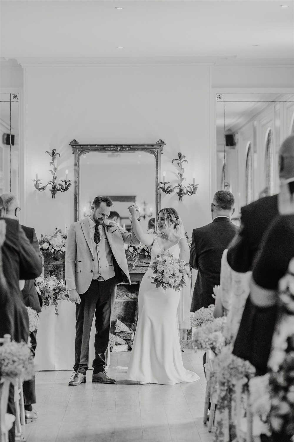 black and white photo of bride and groom celebrating marriage at hotel du vin tunbridge wells wedding ceremony