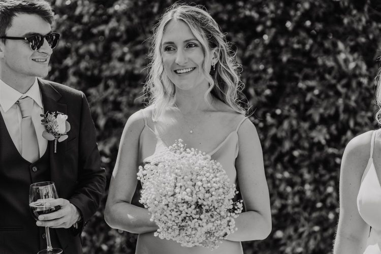 black and white candid guest portraits during drinks reception in the gardens at hotel du vin tunbridge wells wedding