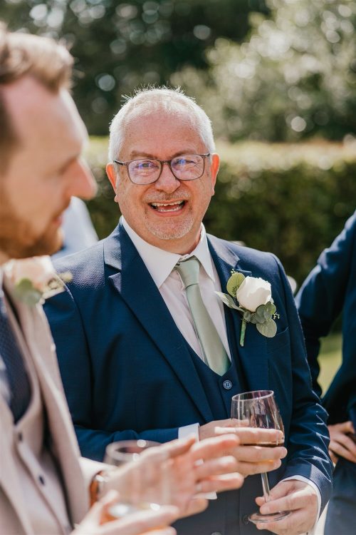 candid guest portraits during drinks reception in the gardens at hotel du vin tunbridge wells wedding