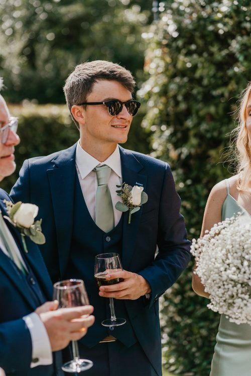 candid guest portraits during drinks reception in the gardens at hotel du vin tunbridge wells wedding