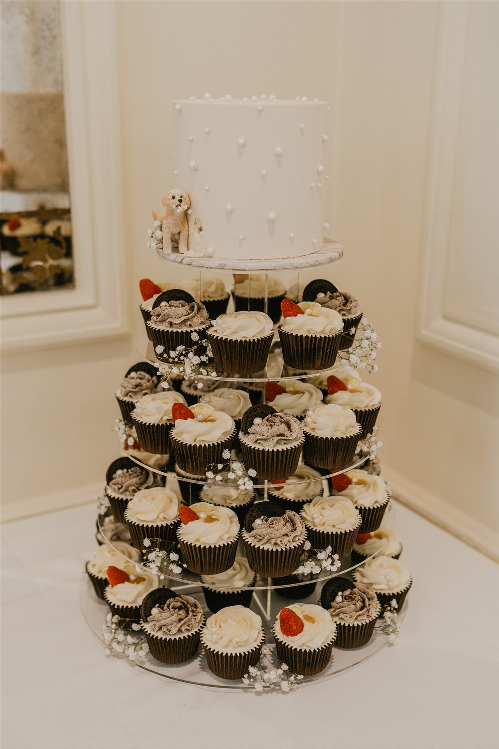 wedding cake with cupcakes