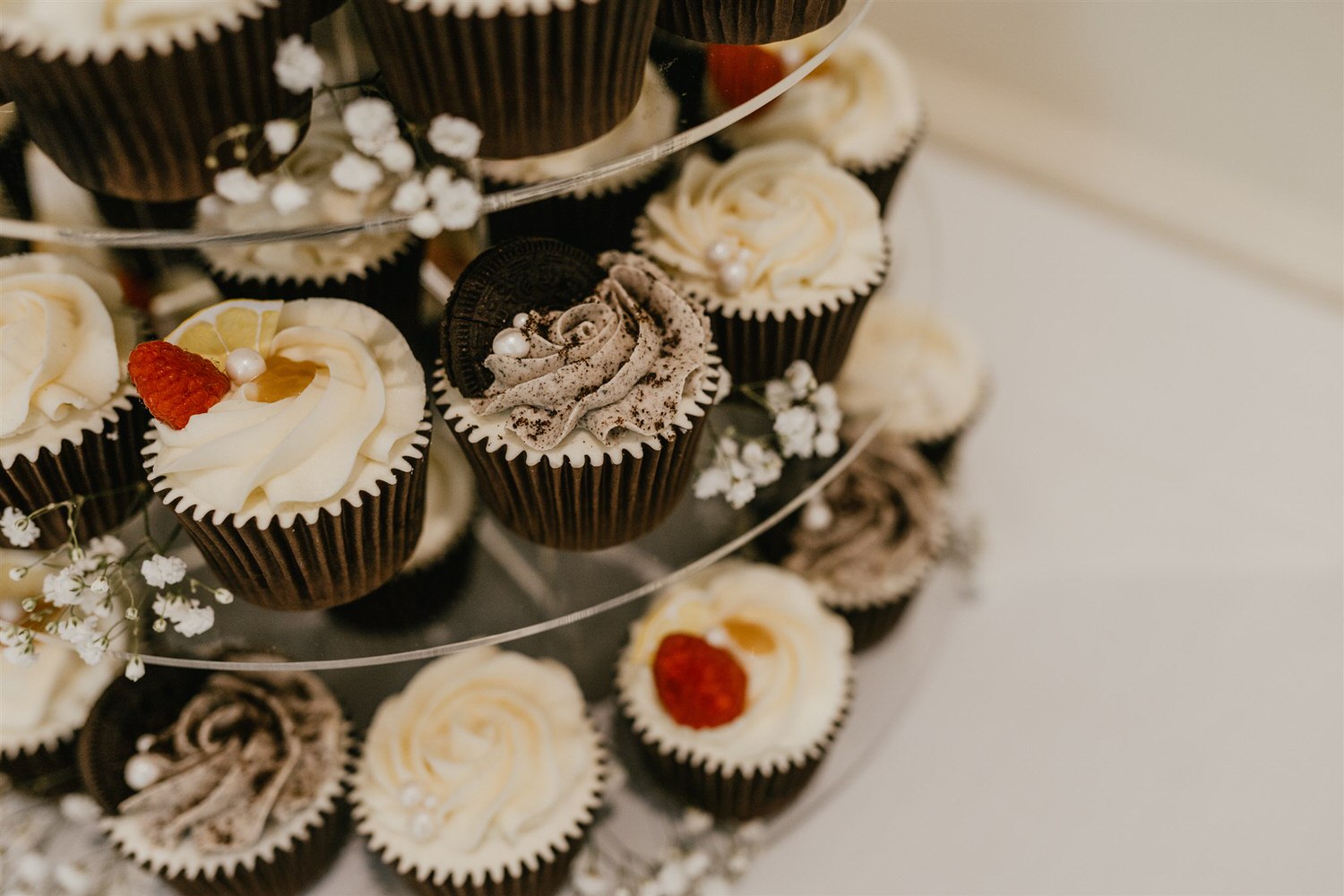 oreo cupcake close up on wedding cake tier stand