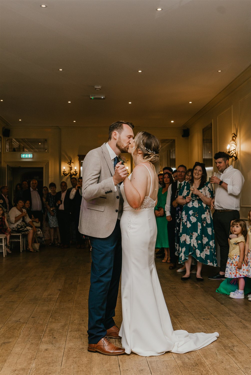 bride and groom kiss during first dance at hotel du vin tunbridge wells wedding